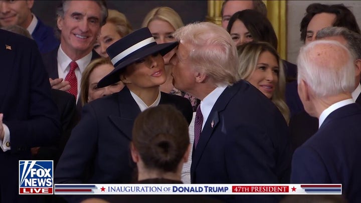 Trump attempts to kiss Melania as he enters swearing-in ceremony